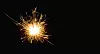 Bright sparks on deep black background closeup. Party holiday sp