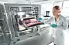 Lab technician operating Incucyte inside an Incubator