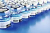 Concept for availability of enough vaccine against new corona virus SARS-CoV-2: Rows of glass container of vaccination. The word vaccination in English, Spanish, French and German on the label