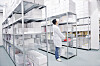 medical factory supplies storage indoor with workers people